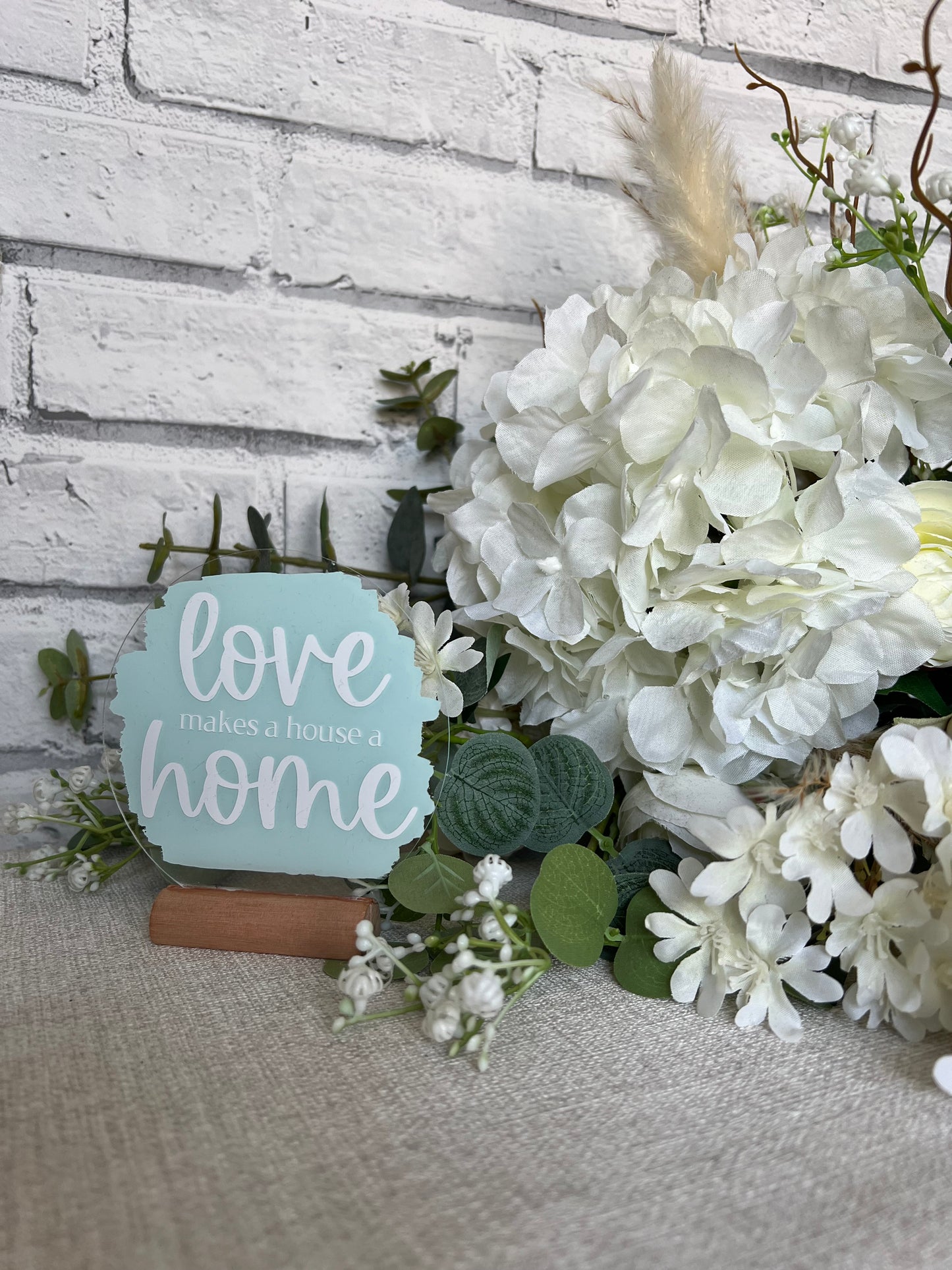 Love makes a house a home acrylic plaque