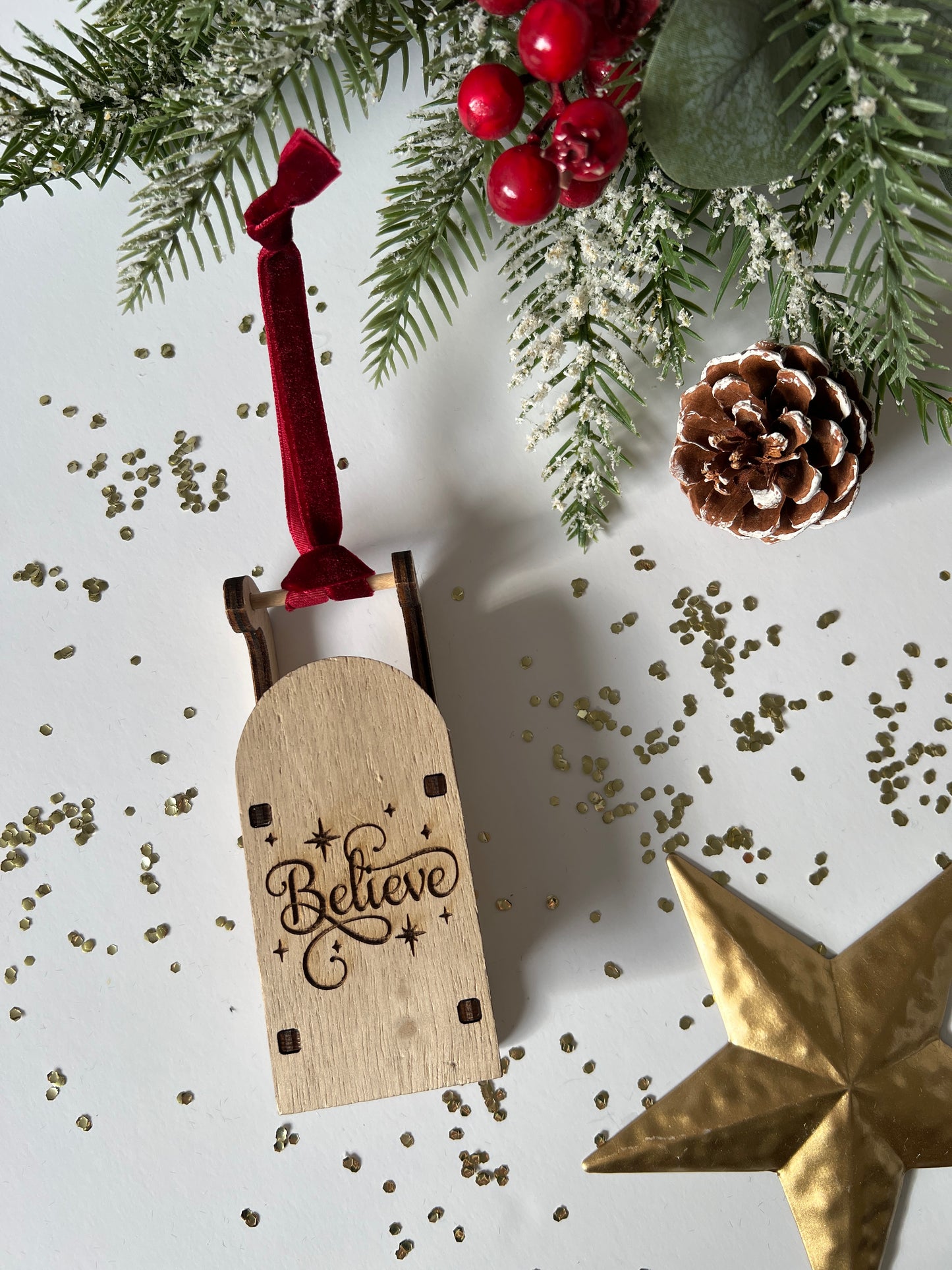 Believe engraved wooden sleigh tree decoration