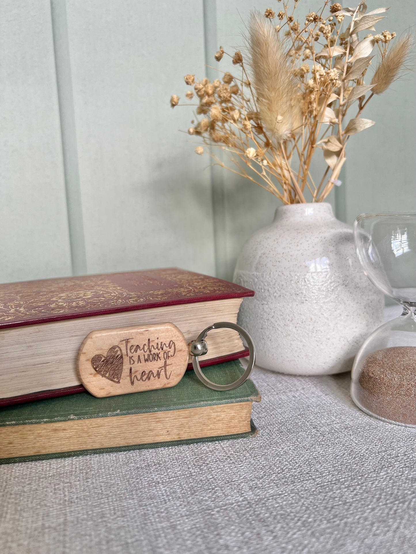 Teaching is a work of heart engraved keyring