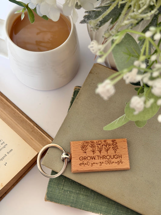 Grow through what you go through engraved keyring
