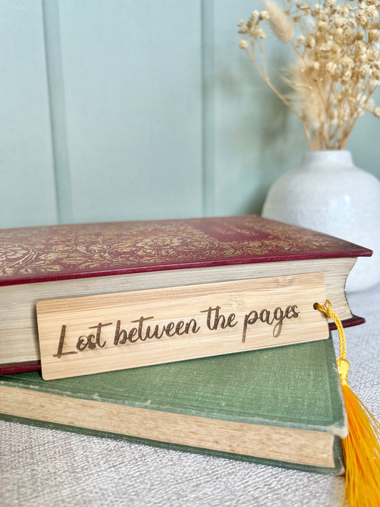 Lost between the pages wooden engraved bookmark