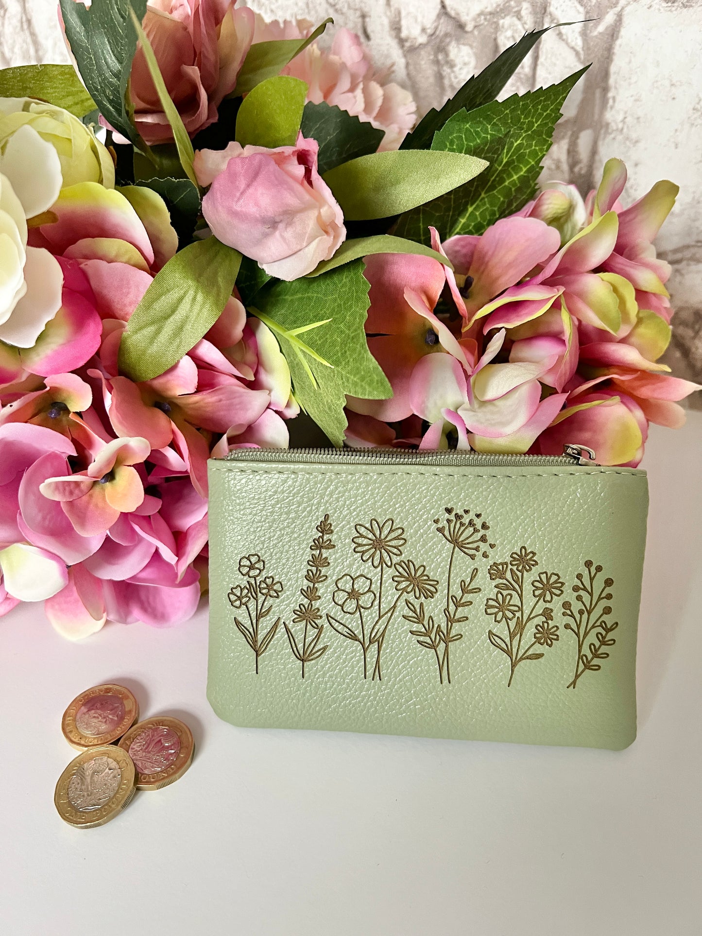 Green coin purse with image of wildflowers