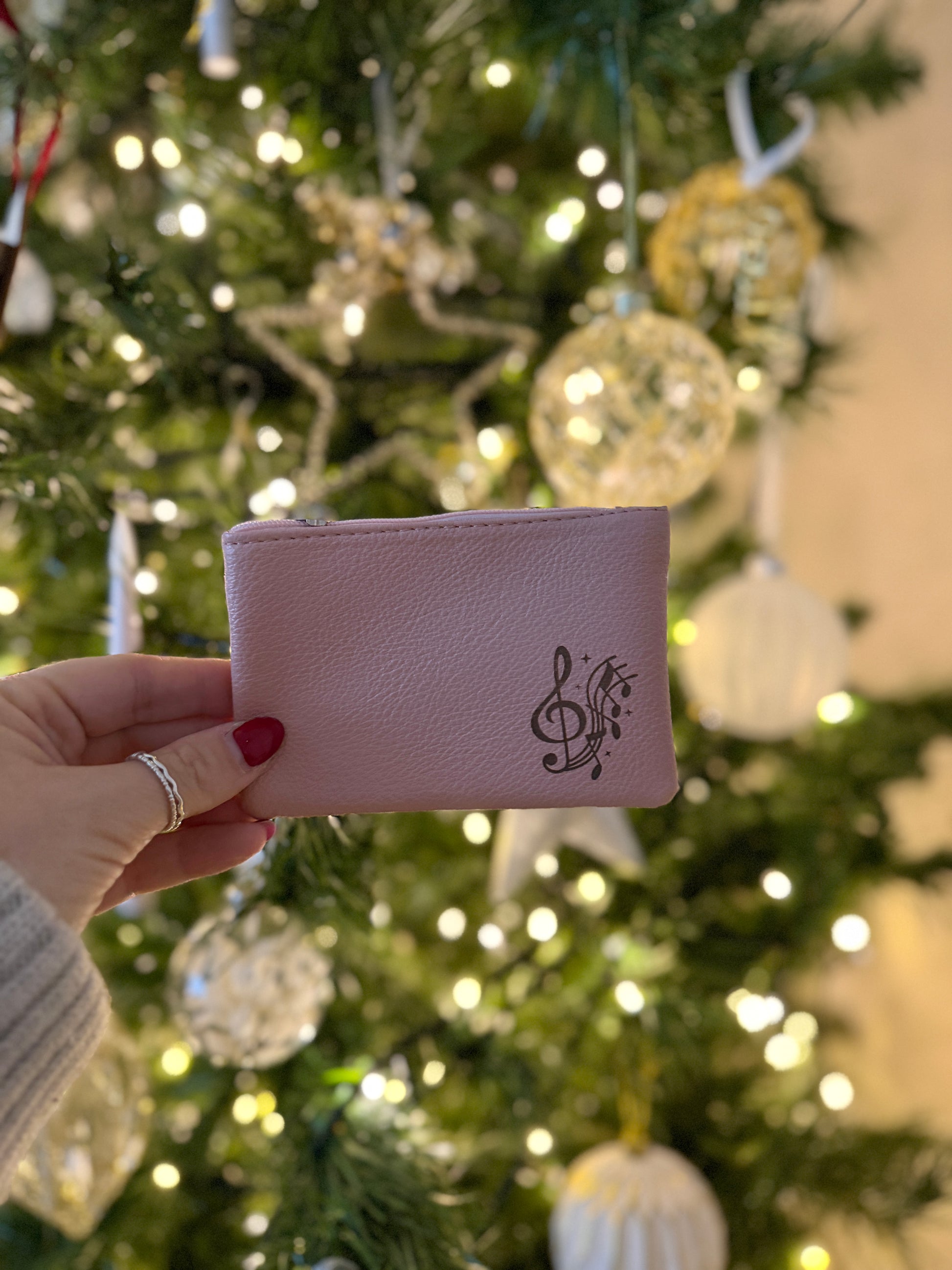 Pink coin purse with treble clef and music notes
